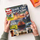 Titelbild der Zeitschrift „Welt der Wunder“ mit dem Hauptthema „Die größten Energielügen 2026“. Zentrale Grafik zeigt ein Tankschiff auf dem Meer, eine Ölplattform, Flammen und eine wehende iranische Flagge im Hintergrund. Abgebildet sind zudem zwei männliche Personen in Anzügen, Diagramme mit fallenden Kurslinien sowie kleinere Themenfelder u. a. zu „Der Sturm der Mongolen“, „Facebook und Gesundheit“ und „Die kuriosen Verbrechen der Tiere“.