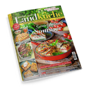 Titelbild der Zeitschrift „meine gute Landküche“ (Juli/August 2016) mit grün-gelbem Schriftzug und dem Titelthema „Genießen im Sommer“. Abgebildet ist eine rote Auflaufform mit Gemüse-Quiche auf Holztisch, umgeben von frischen Tomaten und Kräutern. Seitlich kleinere Bilder mit Speisen wie Focaccia, Steaks, Kuchenschnitten und sommerlichem Obst, dazu Textüberschriften zu Rezeptideen und Gartentipps.