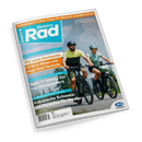 Titelblatt der Zeitschrift „ElektroRad“ mit einem Mann und einer Frau auf E-Bikes auf einem Schotterweg vor bergiger Landschaft. Überschriften in Orange, Blau und Weiß, darunter: „Für neue Horizonte – 13 SUV-Bikes mit High-End-Technik“, „Test: 11 Sättel für top Sitzkomfort“, „Fränkische Schweiz: Ein Paradies für Radler“. Oben oranger Balken mit dem Text „Sommerglück: Hitze-Tipps für Mensch und Maschine“.