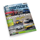 Schräg auf schwarzem Hintergrund liegendes, glänzendes Magazincover „sportscars Auto Bild“ mit mehreren roten, weißen und blauen Sportwagen sowie weiteren gelben und weißen Fahrzeugen in Fotomontagen. Sichtbare Texte: „TECHNO-SZENE“, „VERGLEICHSTEST“, „Audi RS 5 HYBRID und ELEKTRO Hyundai Ioniq 6 N gegen VERBRENNER BMW M3 Competition“, „GEWINNSPIEL Die Sportscars des Jahres 2026“ und „HAUSbesuch bei Alpine in Frankreich“.