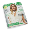 Schräg fotografiertes Magazincover „COSMOPOLITAN“ mit grün-weißer Gestaltung und einer weiblichen Person mit blondem, schulterlangem Haar in weißer Kleidung. Sichtbare Texte: „THE MONEY ISSUE“, „FUN. FEARLESS. FEMALE.“, „Girls just wanna have funds!“, „Meghan Fahy“, „Charis-ma? Charis-me!“ und „FULL FACE LOOKS“.