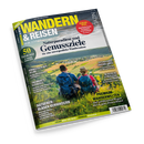 Titelblatt des Magazins „Wandern & Reisen“ Sommerausgabe 03-26, mit Foto zweier wandernder Personen mit Rucksäcken auf einem grünen Hang über einem Tal mit Feldern und Dörfern. Hauptüberschrift: „Naturparadiese und Genussziele für eine unvergessliche Wandersaison“. Weitere sichtbare Texte: „Ratgeber: Blasen verhindern“, „Süddeutschland deluxe“, „Traumhafte Alpenziele“, „Premium-Wanderwelten“, „50 frische Ideen“ und „Gewinnspiele“.