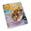 Magazin „essen & trinken“ mit gelbem Titelaufschrift im oberen Bereich. Auf dem Cover ein großer Teller mit mediterranem Gericht aus Fleischspießen, roten Zwiebeln, Paprika, Tomaten und Kräutern, daneben eine kleine Schale mit Oliven und Limettenstücken auf blau-weiß gestreiftem Tuch. Sichtbare Texte: „Mediterrane Urlaubsküche“, „Himbeerträume“, „Mozzarella, Burrata & Co.“, „Saucen-Schule“.