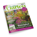 Schräg dargestelltes Gartenmagazin „mein schöner Garten“ mit grünem Titel auf weißem Cover, Ausgabe September 2026. Titelbild mit blühendem Staudenbeet, dazu Texte wie „Blütenglück mit pflegeleichten Fetthennen“, „Zucchini & Kürbis“ und „Klimaschutz + Artenvielfalt“.